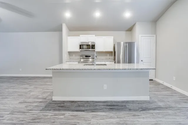 a bathroom with a sink a mirror and a bathtub