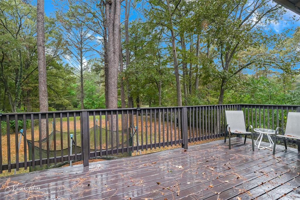 2912 Brookline Drive Shreveport, LA 71119 - Photo 11 of 27 a view of a wooden deck with chairs