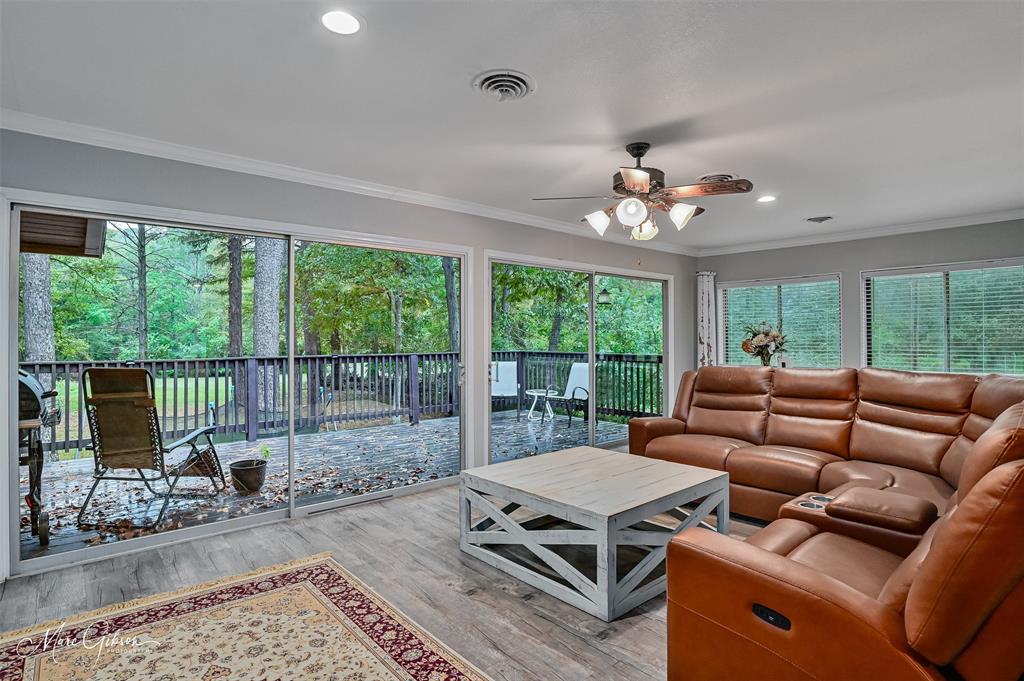 2912 Brookline Drive Shreveport, LA 71119 - Photo 12 of 27 a living room with furniture and a floor to ceiling window