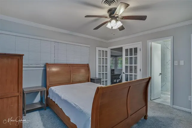 a bed room with a bed and a chandelier