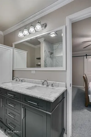 a bathroom with a sink a vanity and a mirror