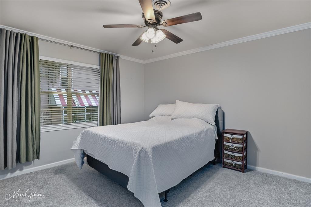 2912 Brookline Drive Shreveport, LA 71119 - Photo 17 of 27 a bed sitting in a bedroom next to a window