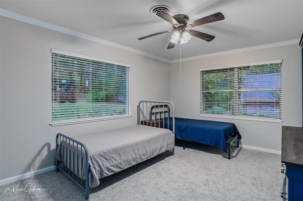 2912 Brookline Drive Shreveport, LA 71119 - Photo 19 of 27 a bedroom with a bed and a large window