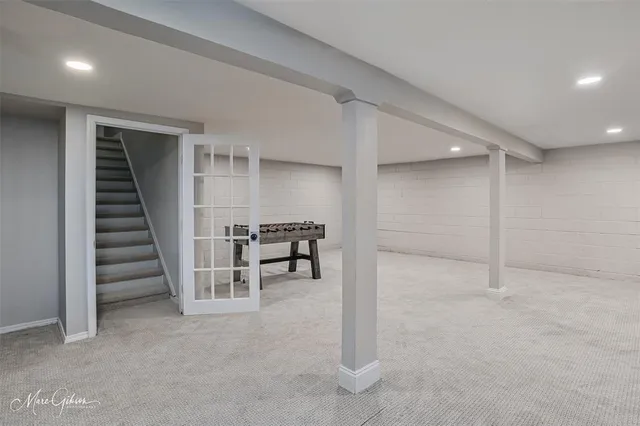 a view of an empty room with stairs