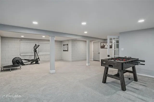 a room with gym equipment and a table