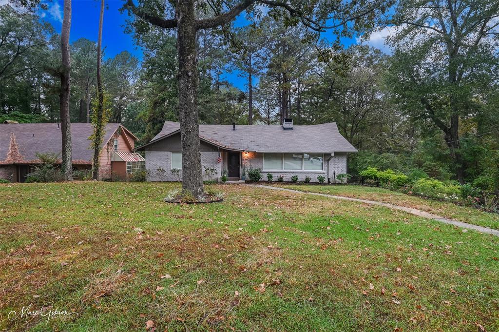 2912 Brookline Drive Shreveport, LA 71119 - Photo 23 of 27 a front view of a house with garden