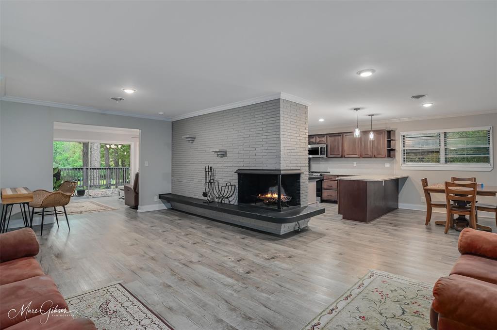 2912 Brookline Drive Shreveport, LA 71119 - Photo 3 of 27 a living room with furniture a window and a fireplace