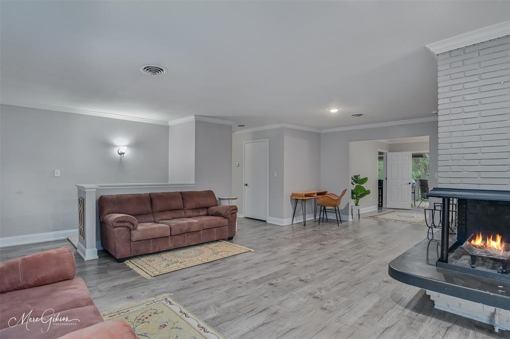 2912 Brookline Drive Shreveport, LA 71119 - Photo 5 of 27 a living room with furniture and a fireplace