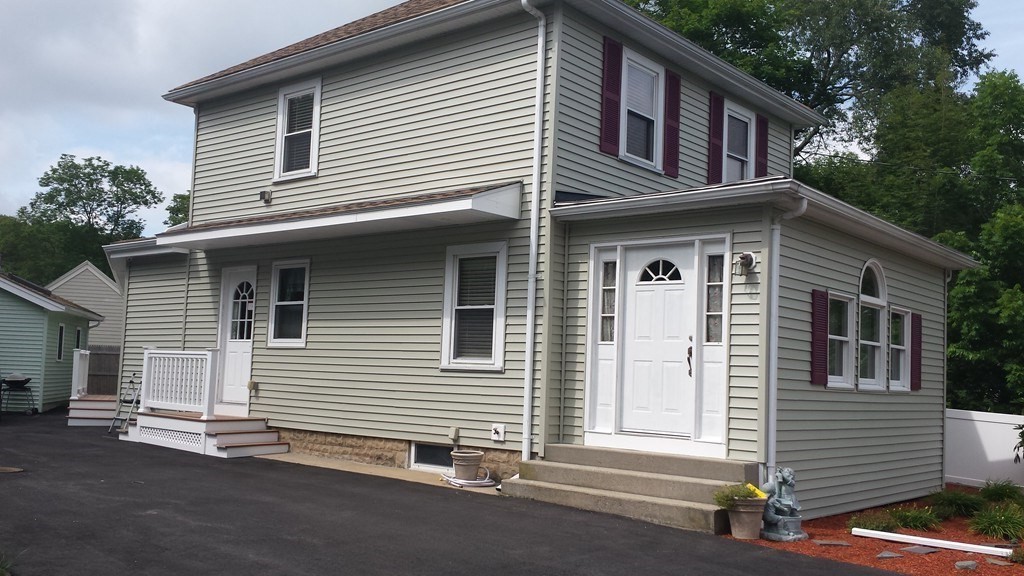79 Wareham Street Middleboro, MA 02346 - Photo 1 of 27 a front view of a house with a garage