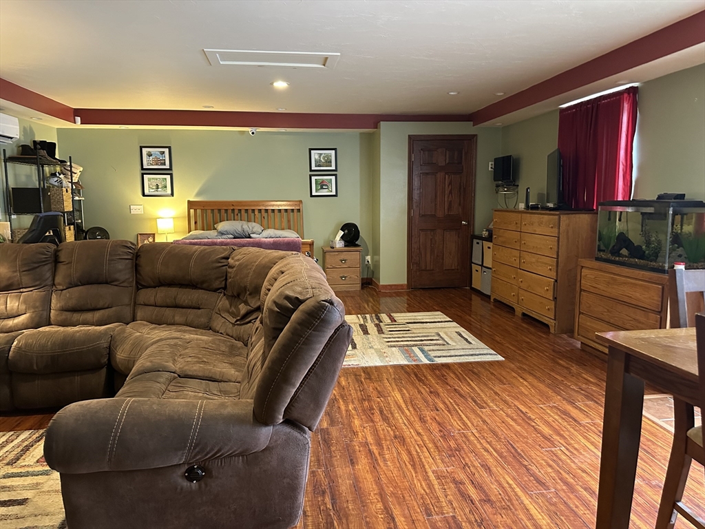 79 Wareham Street Middleboro, MA 02346 - Photo 14 of 27 a living room with furniture a flat screen tv and a dresser
