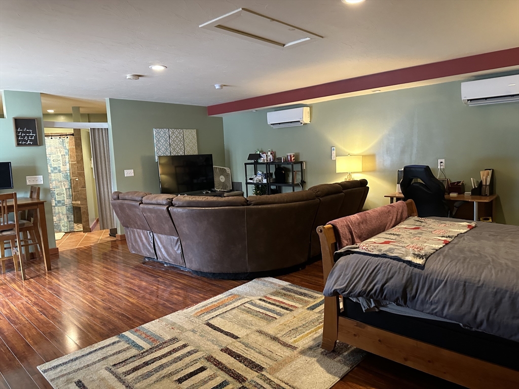 79 Wareham Street Middleboro, MA 02346 - Photo 16 of 27 a bed room with a bed and furniture