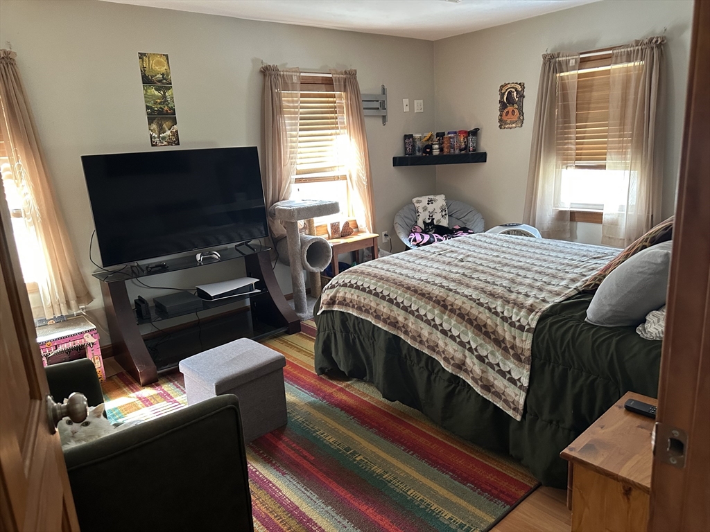 79 Wareham Street Middleboro, MA 02346 - Photo 20 of 27 a bedroom with a bed and a flat screen tv