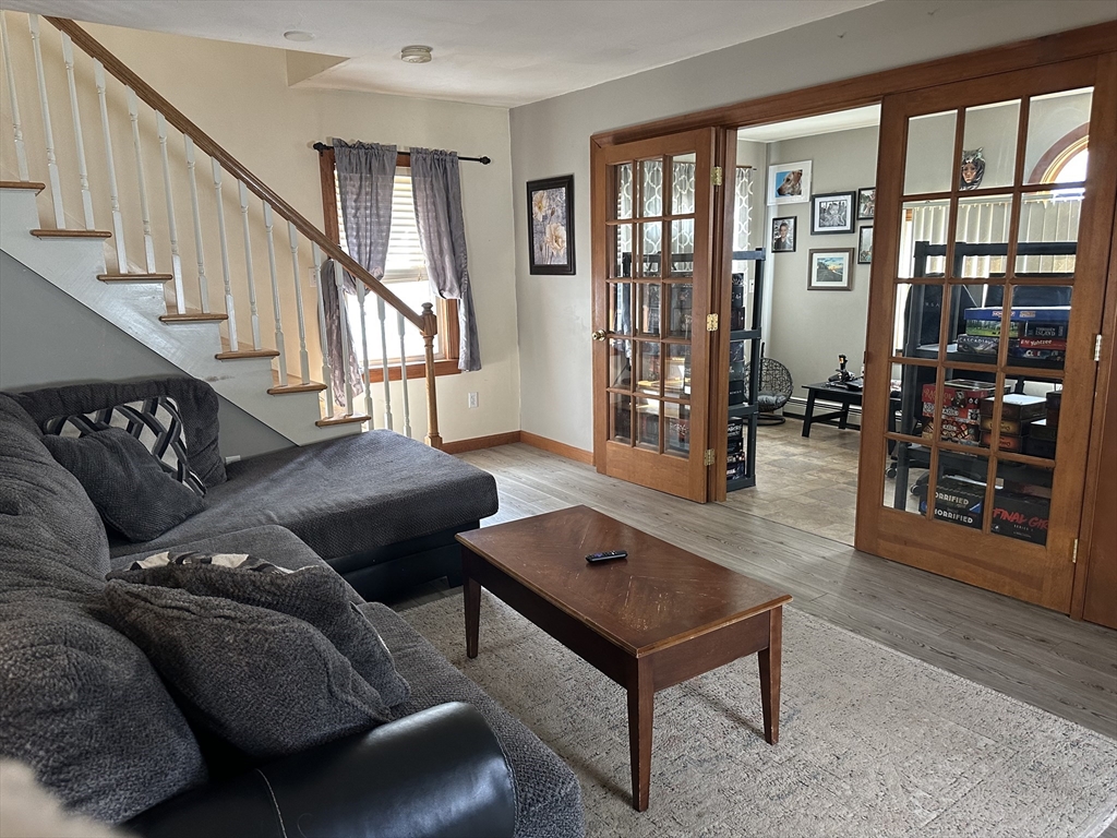 79 Wareham Street Middleboro, MA 02346 - Photo 7 of 27 a living room with furniture and a table