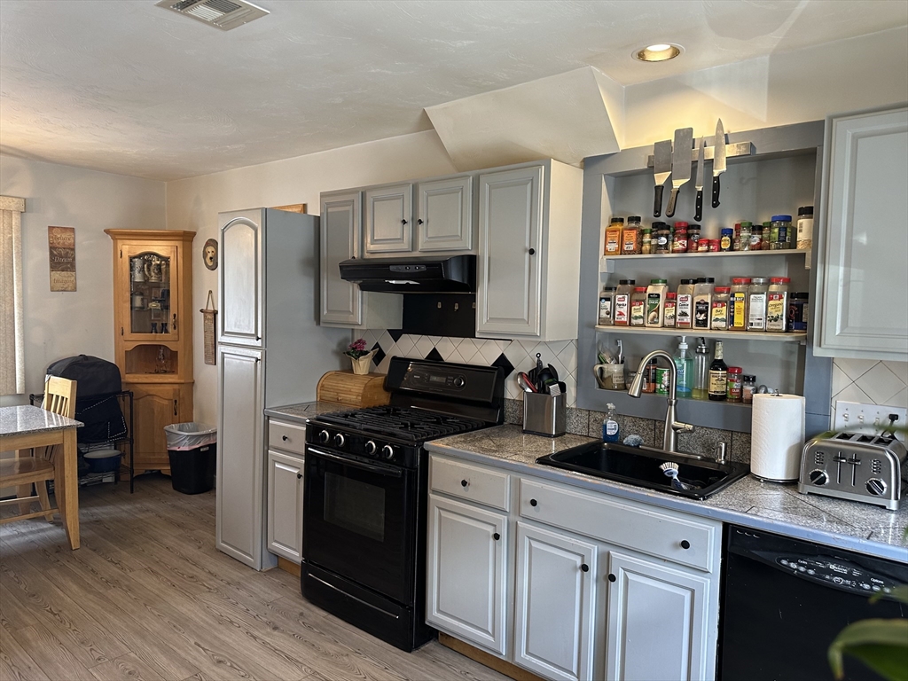 79 Wareham Street Middleboro, MA 02346 - Photo 9 of 27 a kitchen with stainless steel appliances granite countertop a refrigerator stove and sink