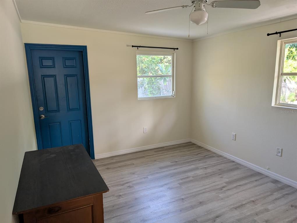 1176 40th Street Sarasota, FL 34234 - Photo 22 of 37 an empty room with windows and closet