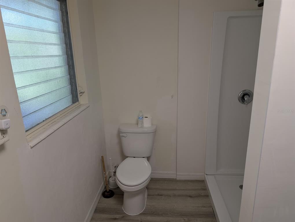 1176 40th Street Sarasota, FL 34234 - Photo 25 of 37 a bathroom with a toilet