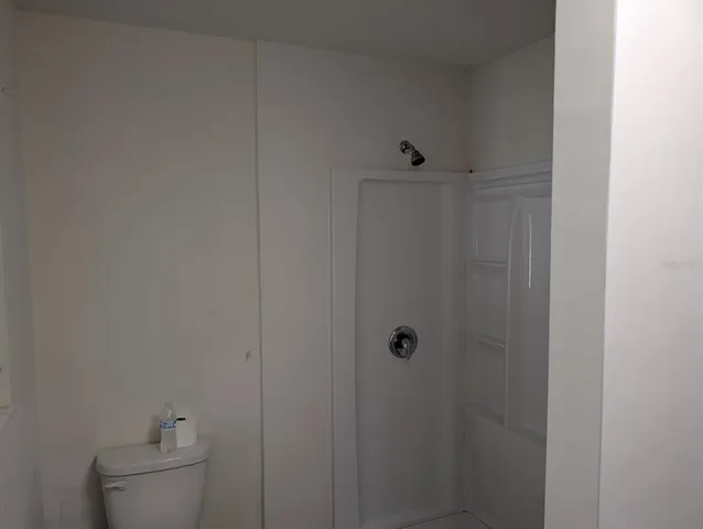 a bathroom with a toilet and sink