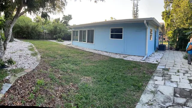 a backyard of a house with lots of green space