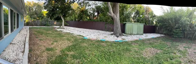 a view of a tiny house with yard