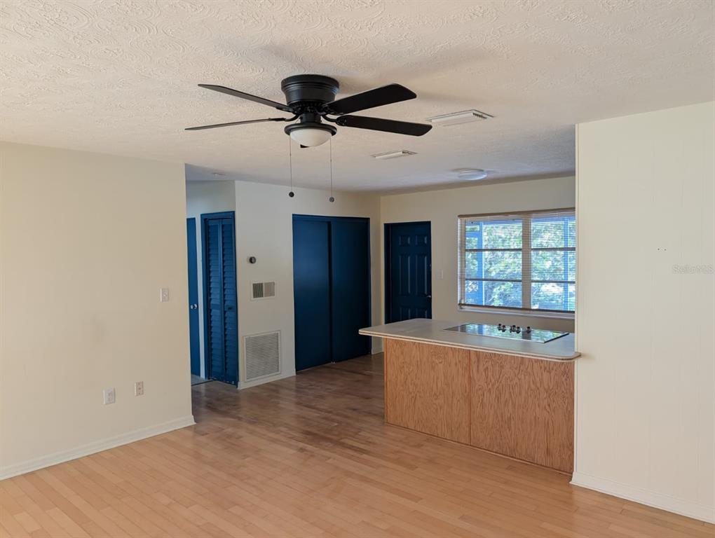 1176 40th Street Sarasota, FL 34234 - Photo 9 of 37 a living room with stainless steel appliances kitchen island furniture and a window