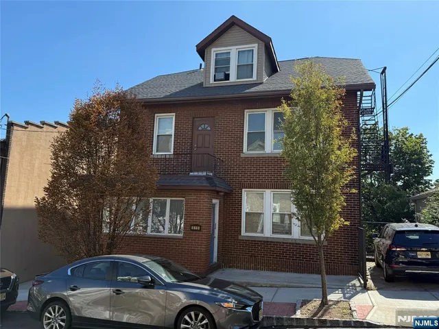 a front view of a house with parking
