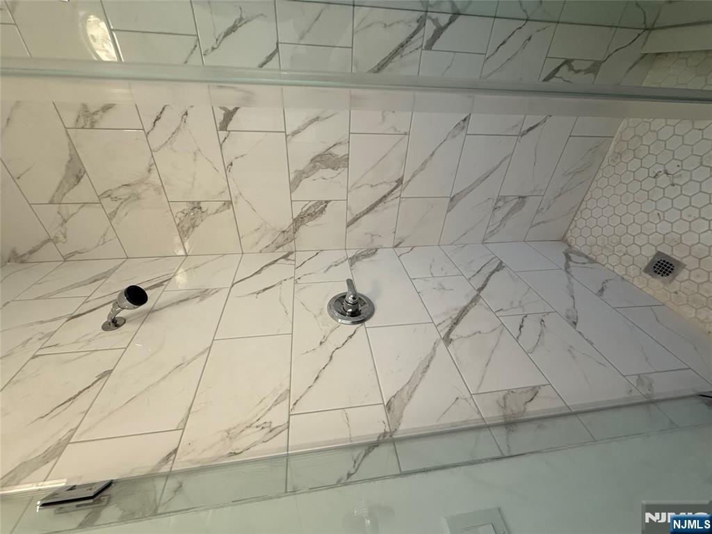610 Gregory Avenue, Unit 2 Weehawken, NJ 07086 - Photo 11 of 18 a bathroom with a shower