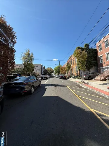a view of street with parked cars