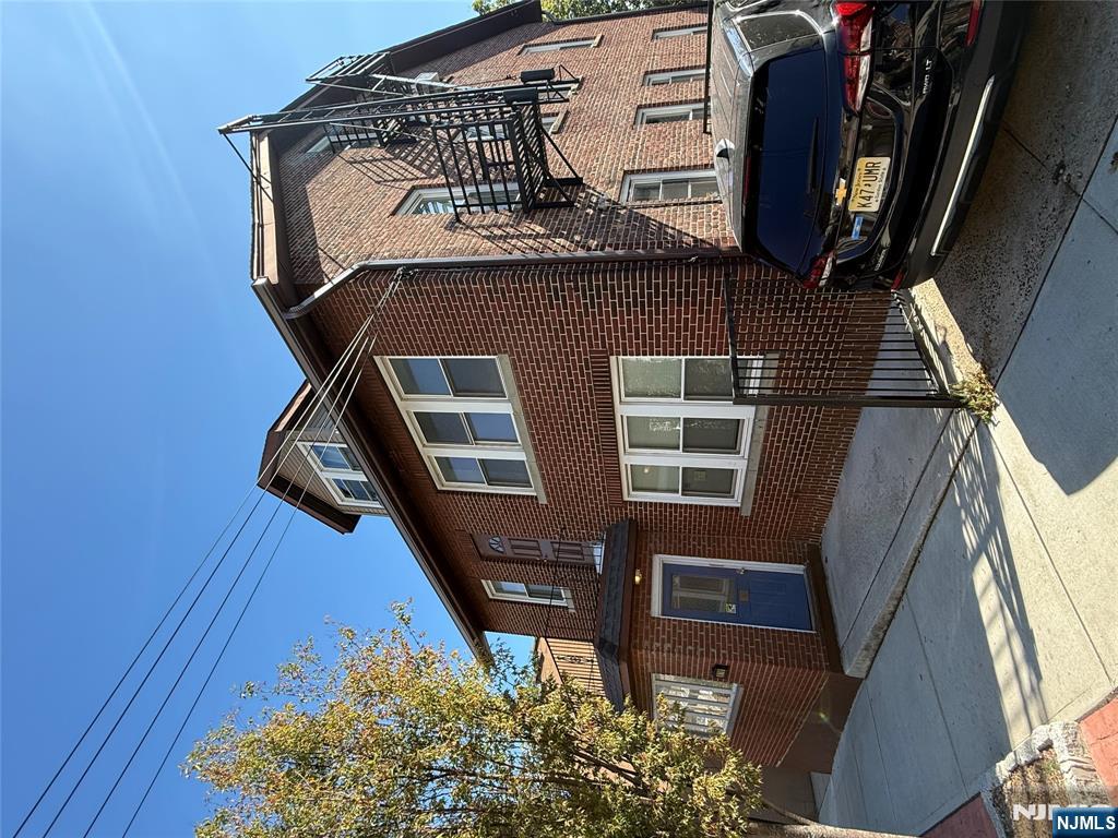 610 Gregory Avenue, Unit 2 Weehawken, NJ 07086 - Photo 2 of 18 a car parked in front of a house