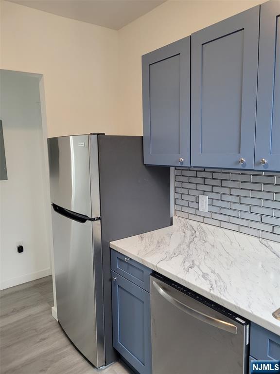 610 Gregory Avenue, Unit 2 Weehawken, NJ 07086 - Photo 6 of 18 a kitchen with a refrigerator and a sink