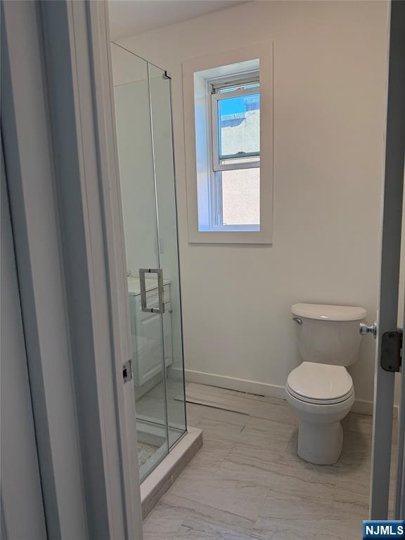 610 Gregory Avenue, Unit 2 Weehawken, NJ 07086 - Photo 10 of 18 a bathroom with a toilet and a shower