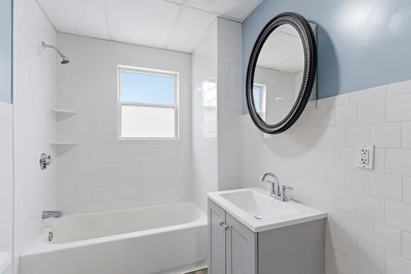 a bathroom with a sink a toilet and a bathtub