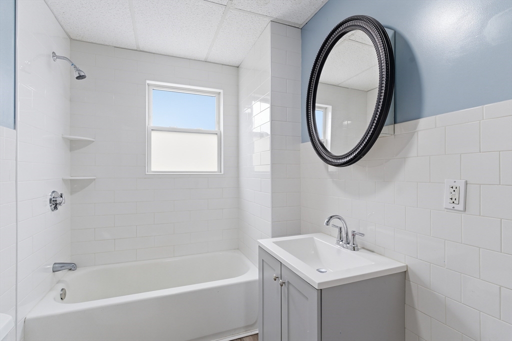 545 Brayton Avenue Fall River, MA 02721 - Photo 9 of 16 a bathroom with a sink a toilet and a bathtub