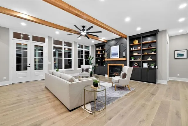 a kitchen with kitchen island granite countertop a sink counter and chairs