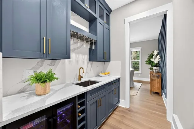 a dining room with furniture a chandelier and wooden floor
