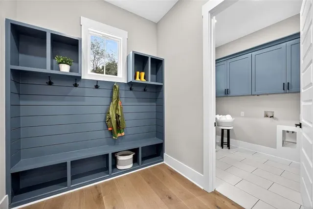 an empty room with window and ceiling fan