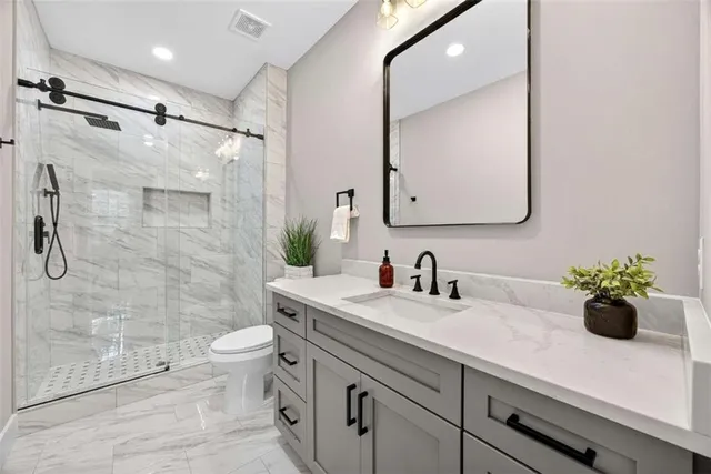 a living room with furniture potted plant and a window