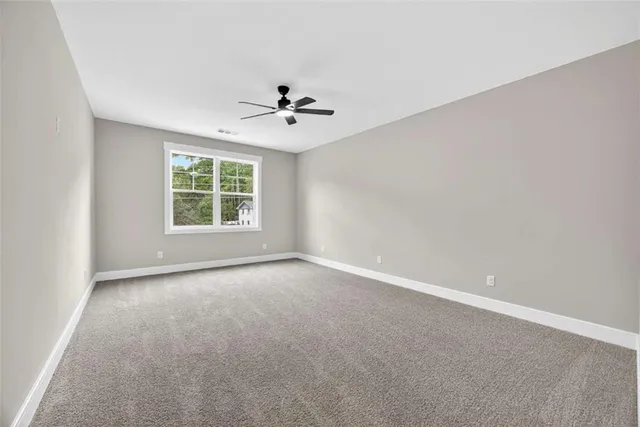 a view of a patio with a dining table and chairs