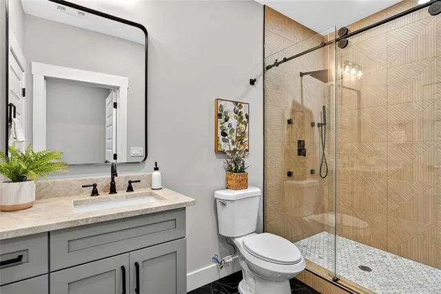 an aerial view of residential houses with outdoor space and street view