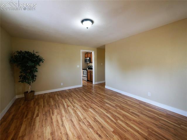 402 Yellowstone Road Colorado Springs, CO 80910 - Photo 7 of 28 New Laminate Flooring, paint, case, and base