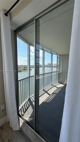 a view of balcony with a floor to ceiling window