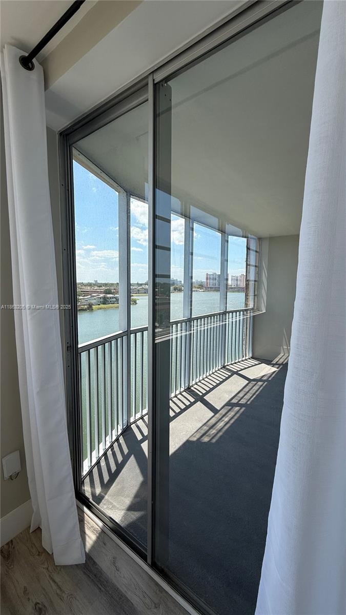 1750 Northeast 191st Street, Unit 7254 Miami, FL 33179 - Photo 16 of 16 a view of balcony with a floor to ceiling window