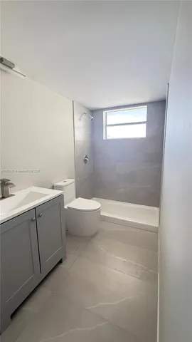 a bathroom with a bathtub and a sink