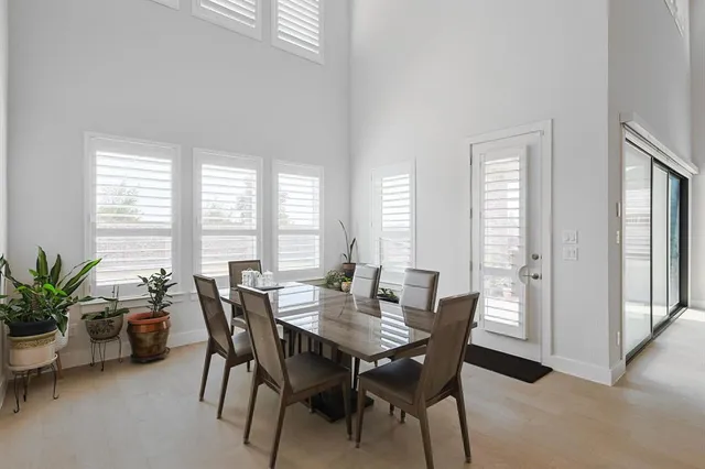 a view of a dining room with furniture and window