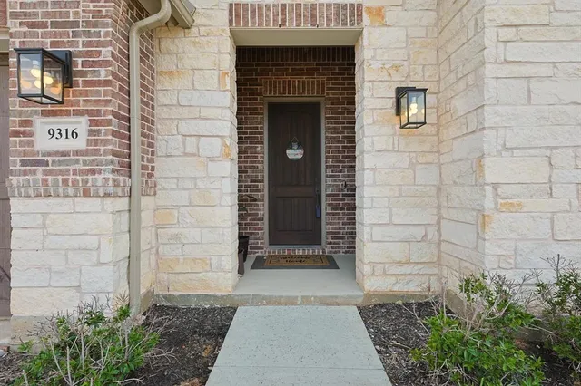 a front view of a house with a door and a window