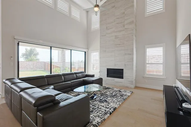 a living room with furniture window and a fireplace