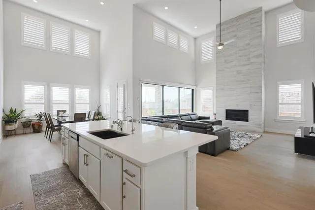 a kitchen with sink stove and refrigerator