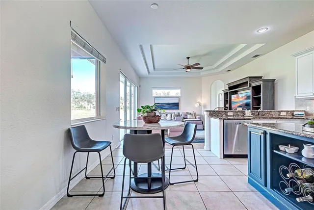 a kitchen with stainless steel appliances granite countertop a sink and cabinets
