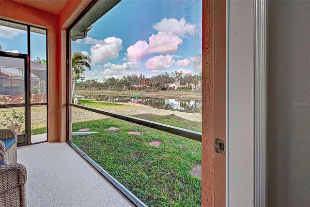 a view of a entryway door with a living room