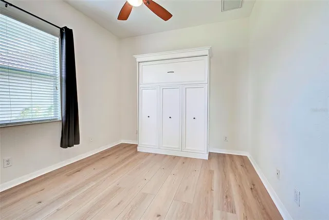 a spacious bathroom with a tub sink and mirror