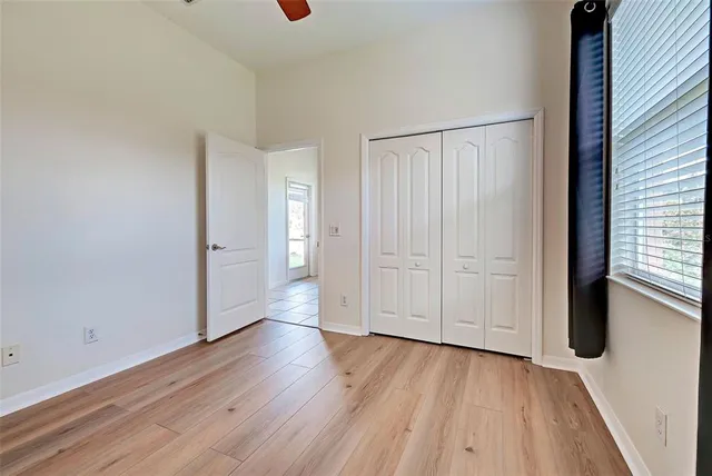 a bathroom with a shower sink vanity granite and mirror